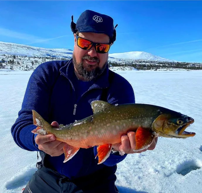 Arctic Char ice fishing in remote mountain scenery!